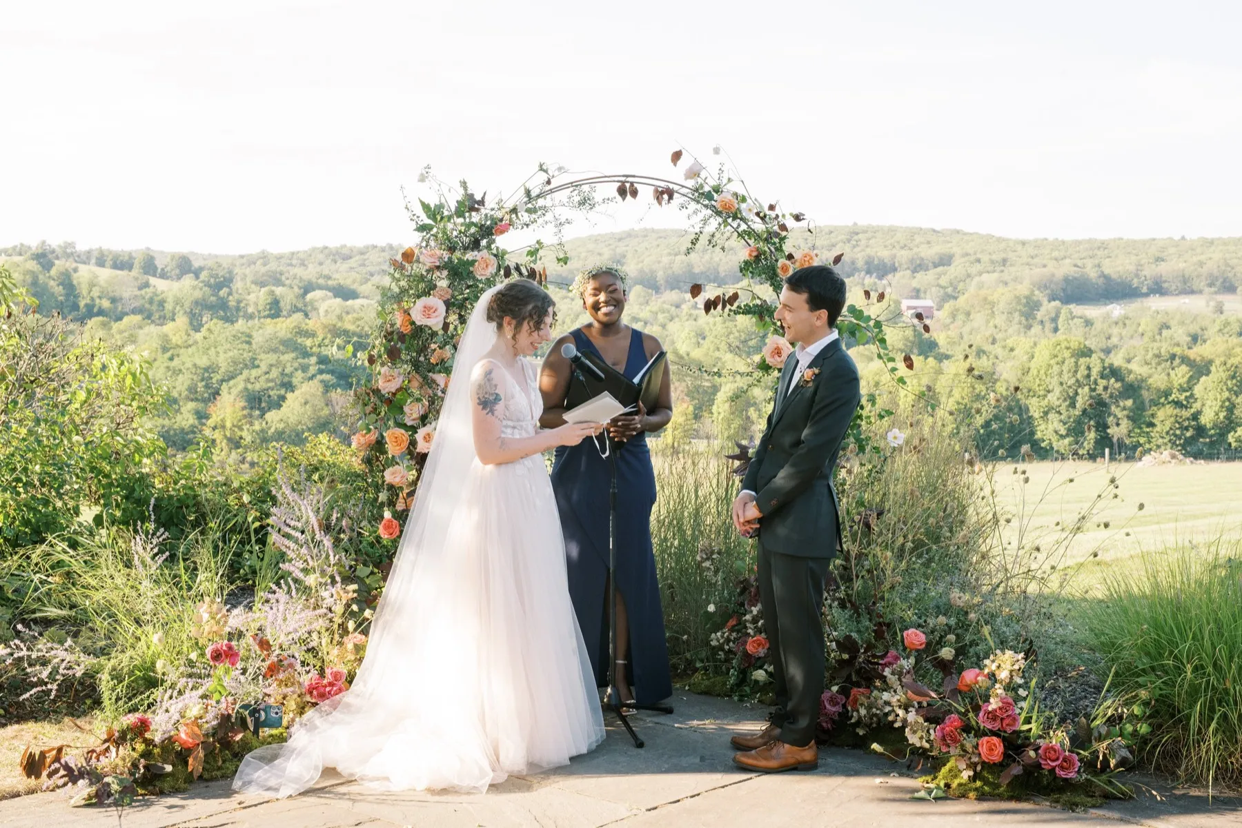 Zoie + Mark celebrating after the ceremony at Sunny River Estates, Hudson Valley, NY