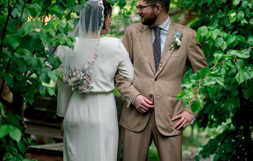A couple exchanging vows in an intimate ceremony with only a few people present