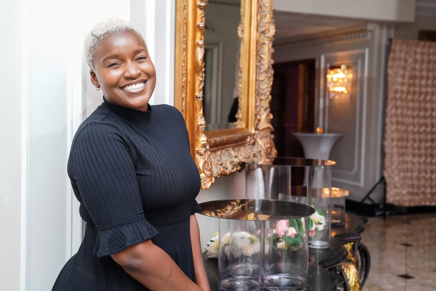 Robyn Walker gesturing to guests during a ceremony