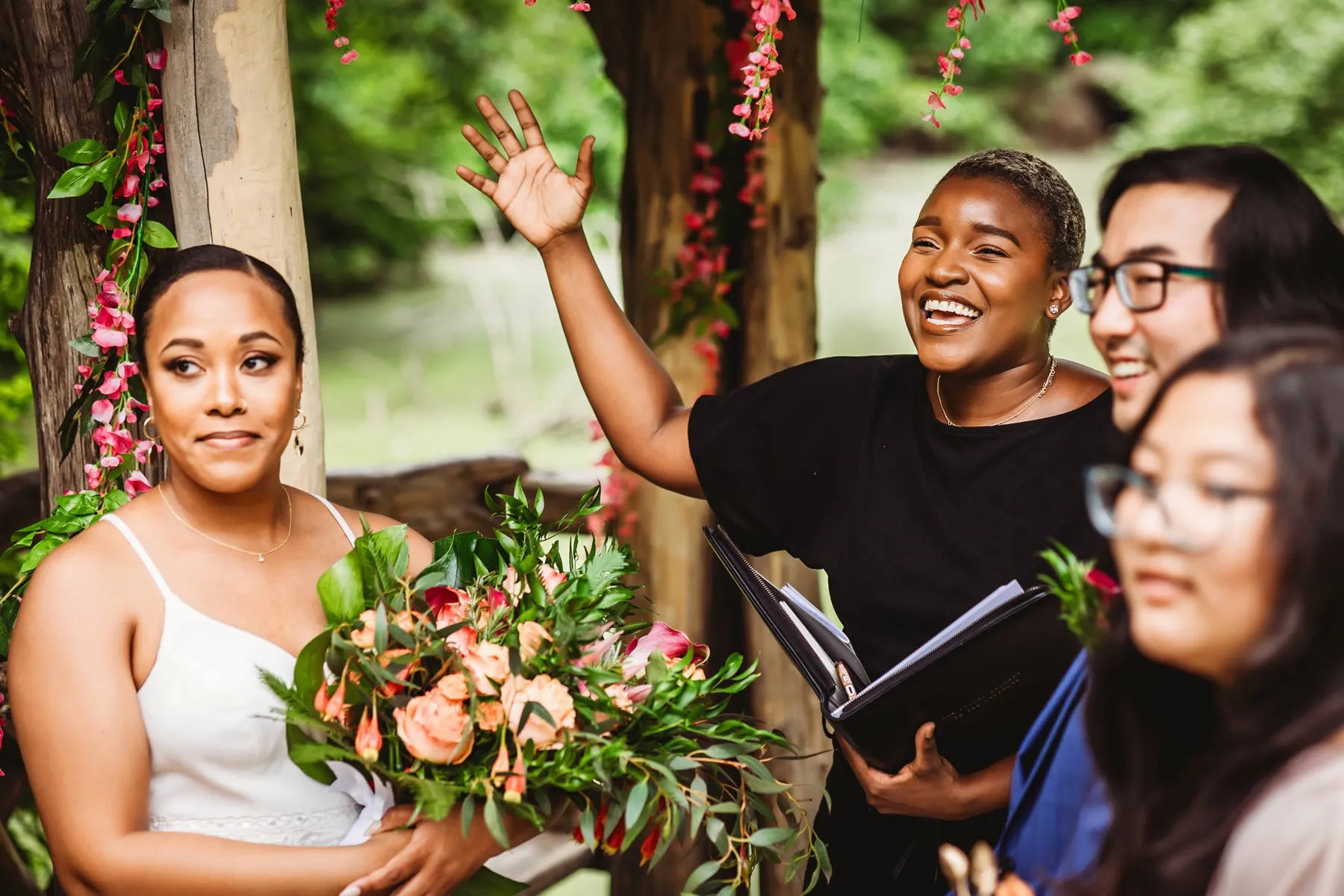 A couple celebrating with raised hands at a Wagner Cove elopement